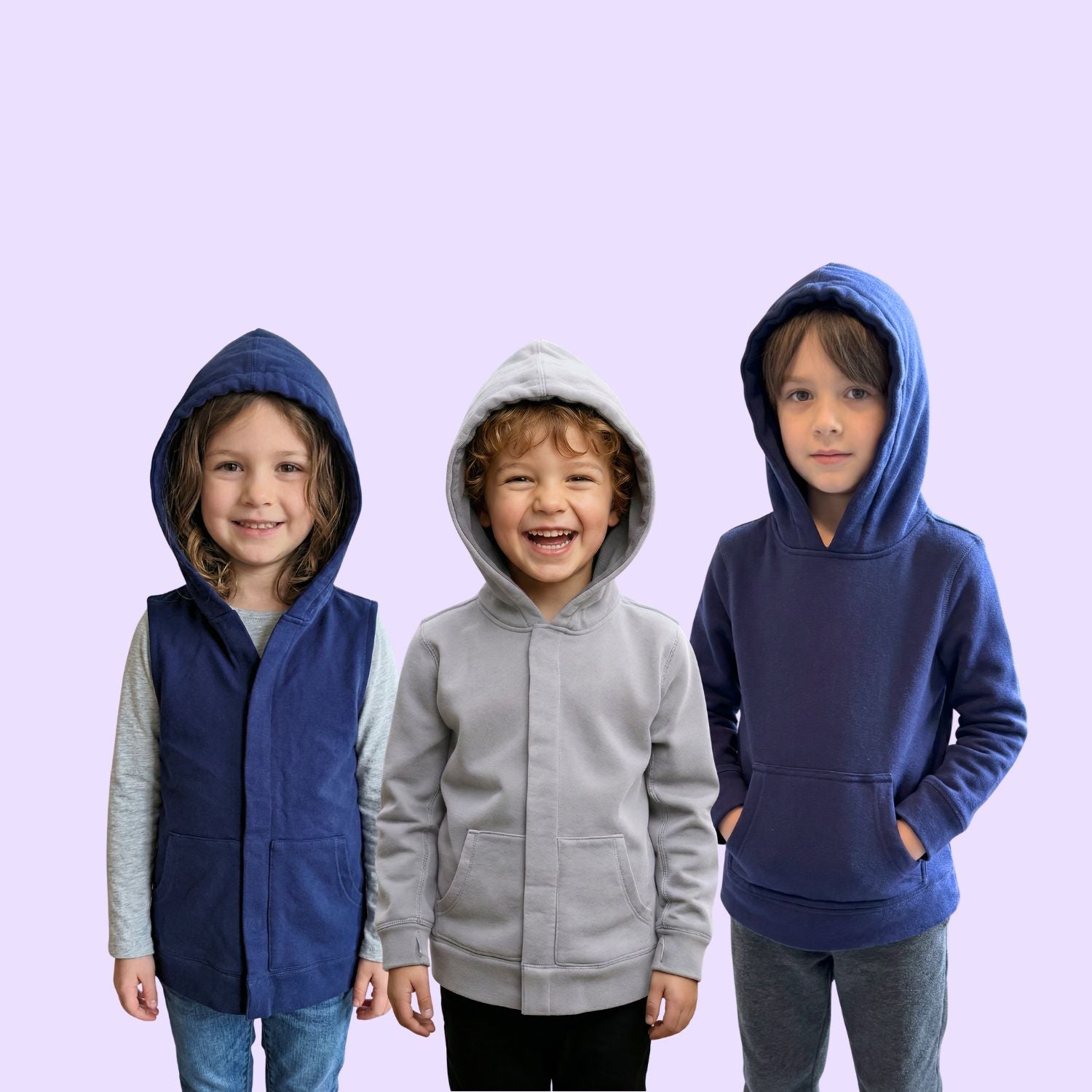 Kids in sensory clothing. Left: sound reducing sensory vest. Middle: Grey sound reducing sensory hoodie. Right: Navy marble maze fidget sensory hoodie.