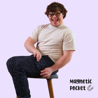 Man with down syndrome showing off magnetic fidget pocket on sensory pants