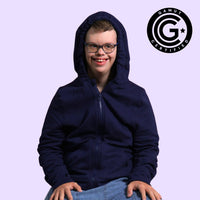 man with disabilities wearing a sensory hoodie with sound reducing hood pulled up with GAMUT Seal of Approval™ in the top right corner.
