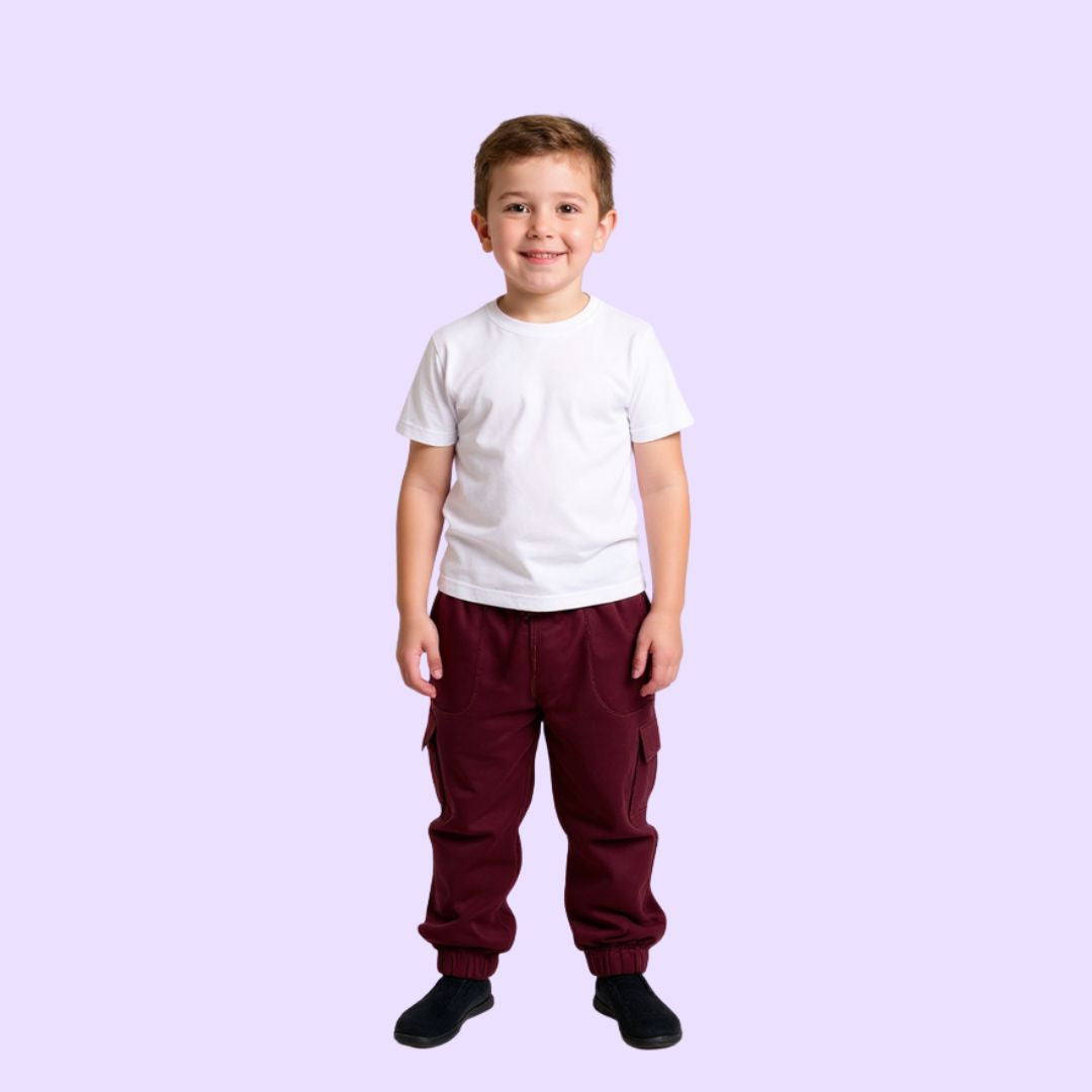 Child wearing a white shirt and maroon pants on a light purple background